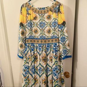 Beautiful lined yellow and blue printed long sleeve dress. Fits size 8 $25
